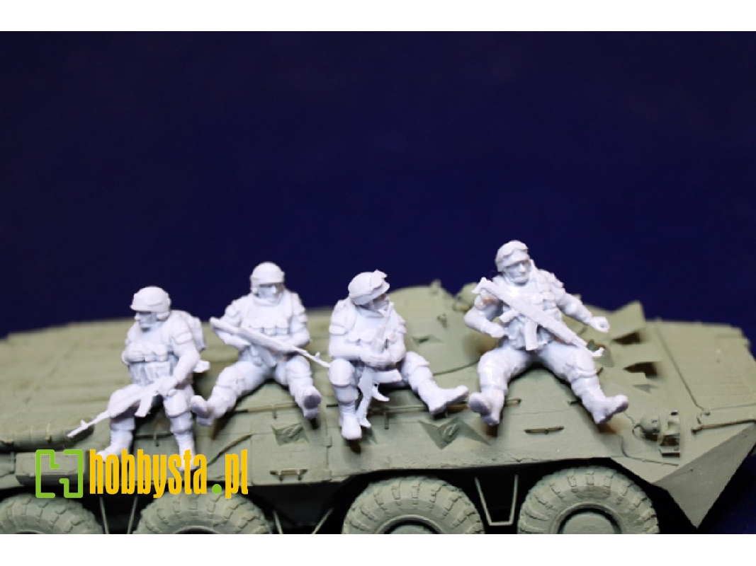 4 Ukrainian Soldiers Sitting On A Vehicle - image 1
