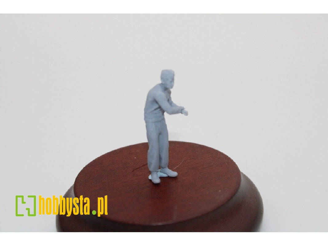 Tank Man Standing Hands On Tower Roof - image 1