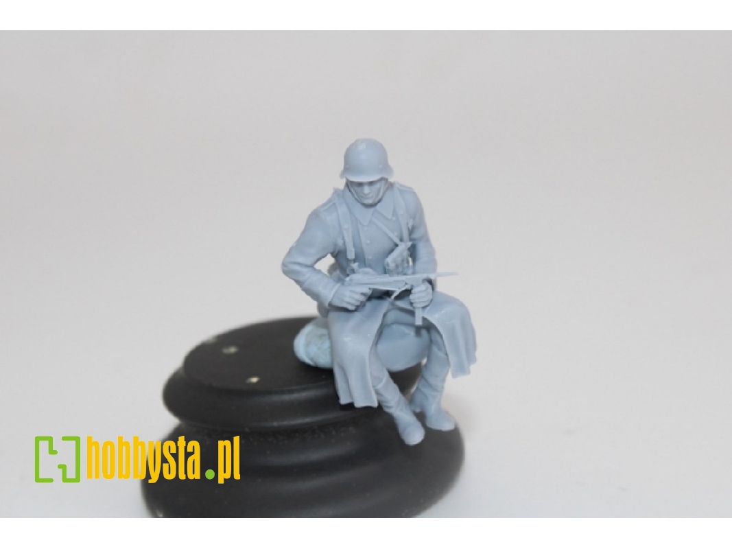 German Soldier Sitting In Greycoat With Mp40 - image 1