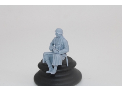 German Soldier Sitting In Greycoat With Mp40 - image 2