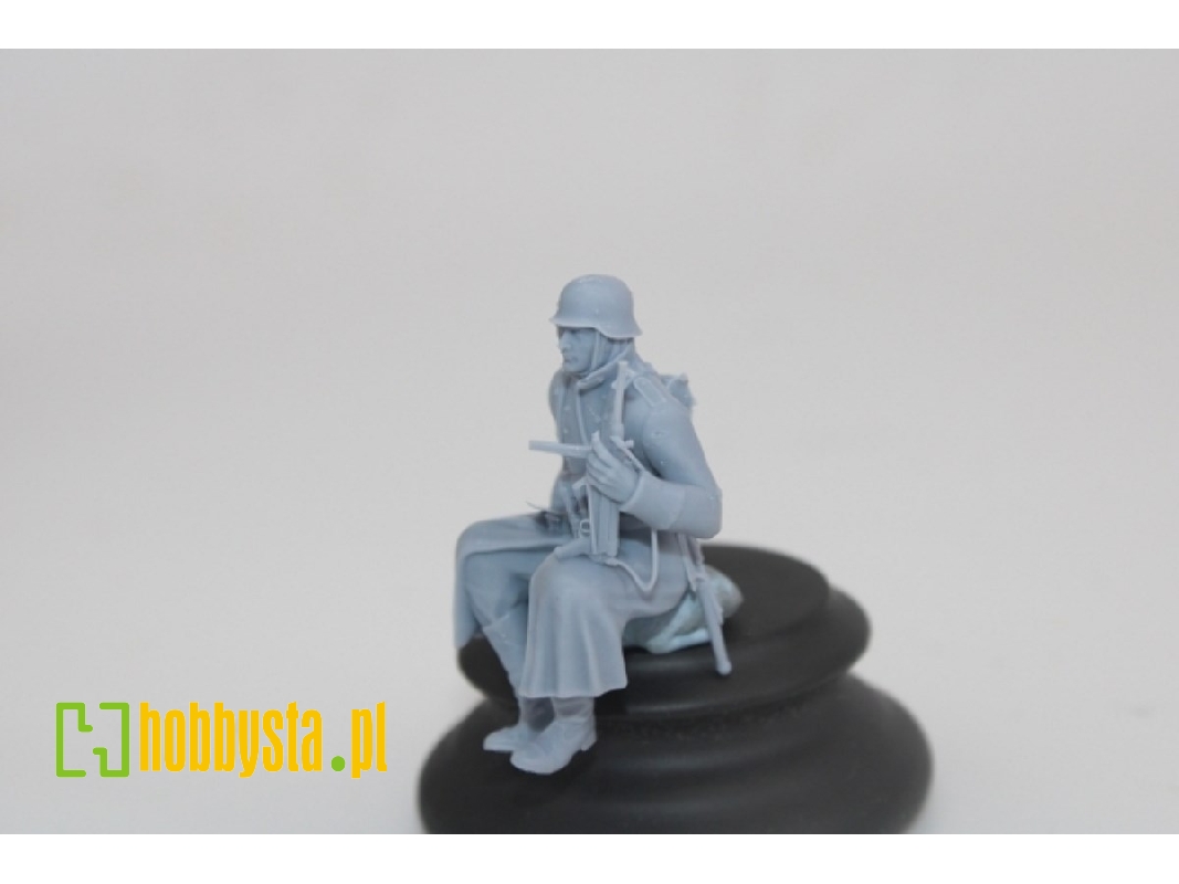 German Soldier Sitting In Greycoat With Mp40 - image 1