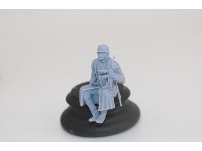 German Soldier Sitting In Greycoat With Mp40 - image 2