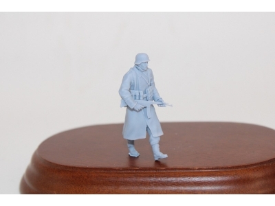 German Soldier Walking In Greycoat With Steelhelmet And Sturmgewehr 44 - image 1