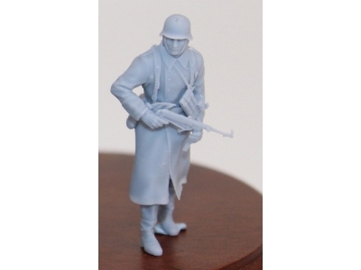 German Soldier Walking In Wintercoat With Steelhelmet And Mp 40 - image 1
