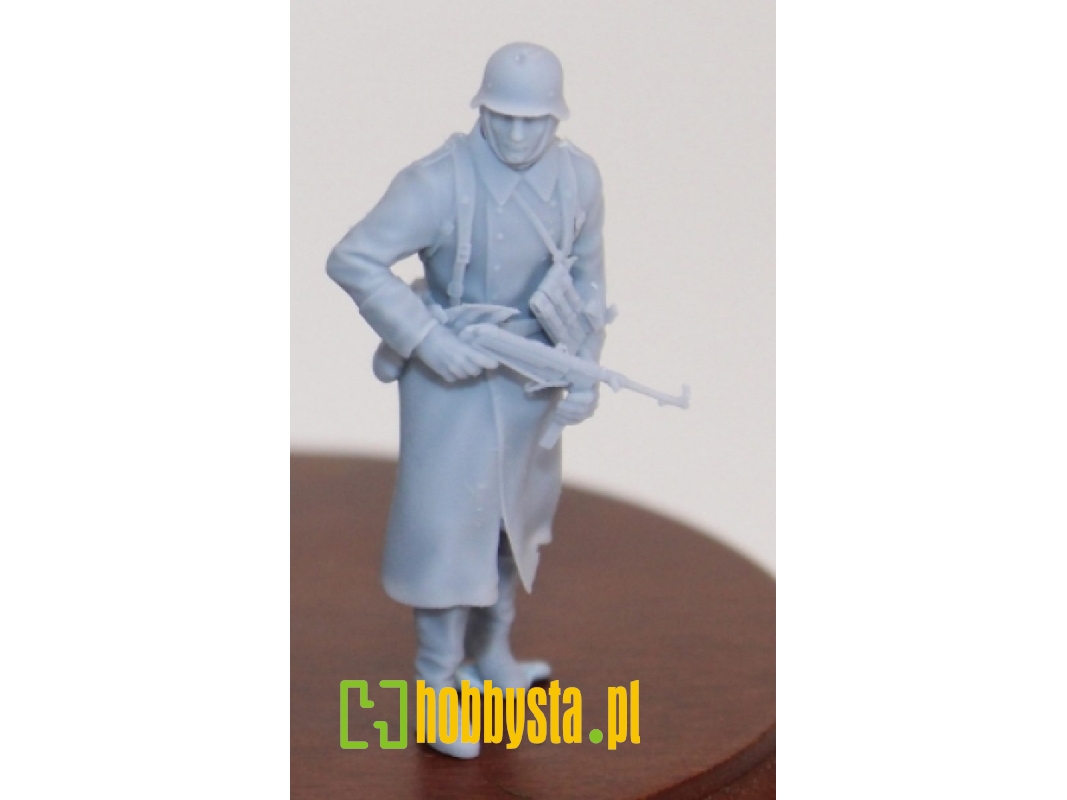 German Soldier Walking In Wintercoat With Steelhelmet And Mp 40 - image 1